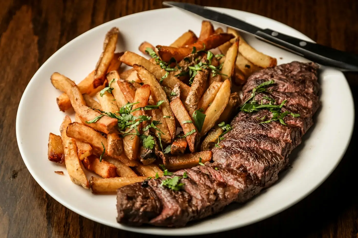 A plate of steak and fries
